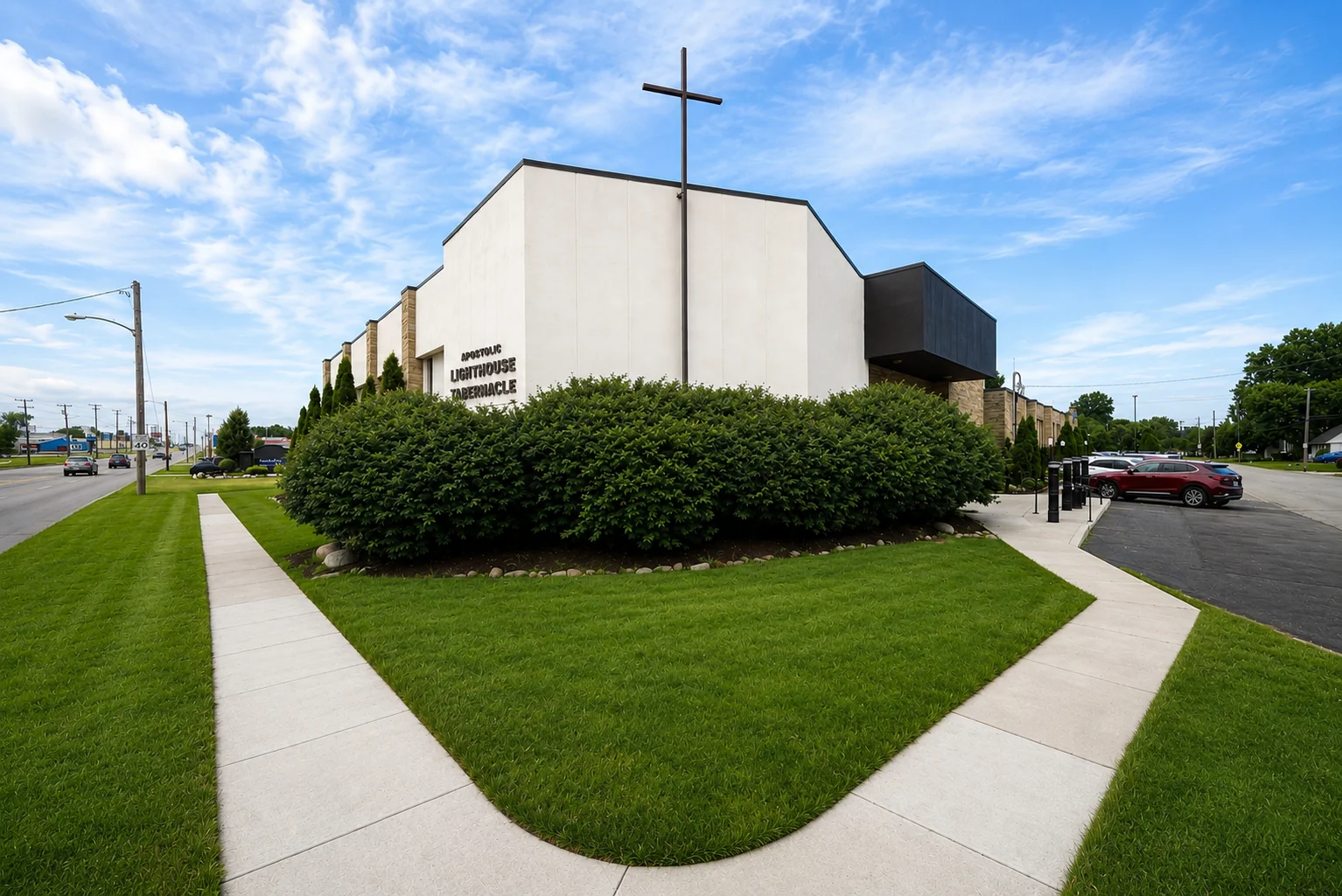 Apostolic Lighthouse Tabernacle building in Massillon, Ohio, with its cross, lawn and front entrance
